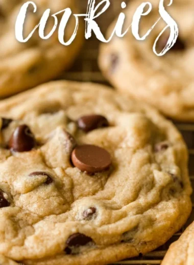 Freshly baked chocolate chip cookies on a cooling rack, warm and delicious