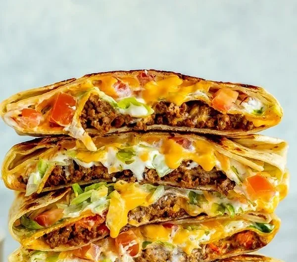 Homemade Copycat Crunchwrap Supreme with layers of ingredients