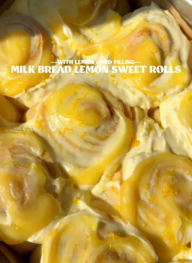 Delicious lemon rolls drizzled with glaze on a plate