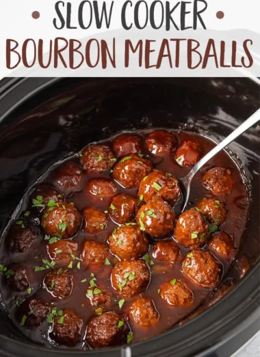 Slow cooker bourbon meatballs served in a delicious sauce