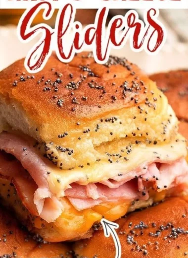 Baked ham and cheese sliders on a serving platter, ready to enjoy.