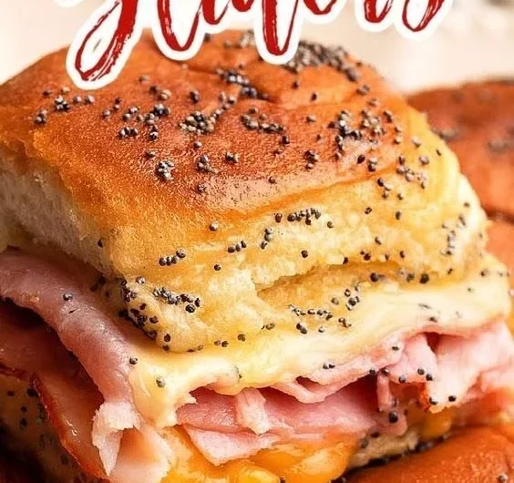 Baked ham and cheese sliders on a serving platter, ready to enjoy.