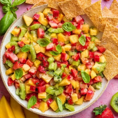 Bowl of fresh fruit salsa served with crispy cinnamon sugar chips