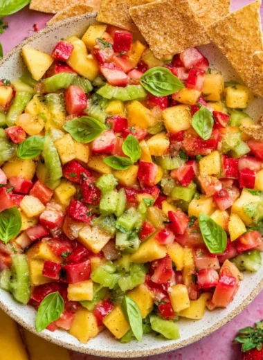 Bowl of fresh fruit salsa served with crispy cinnamon sugar chips