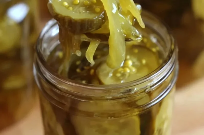 Homemade Grandma's bread and butter pickles in a glass jar with spices