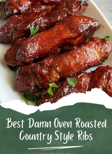 Oven-roasted country-style pork ribs garnished and served on a plate