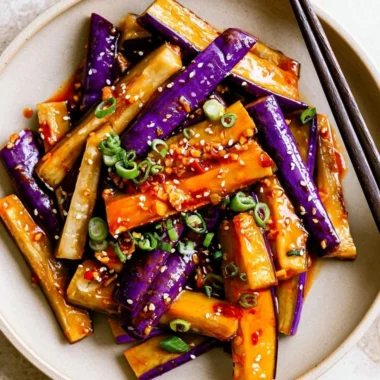 Spicy eggplant stir fry with vegetables in a colorful dish
