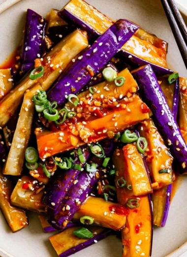 Spicy eggplant stir fry with vegetables in a colorful dish