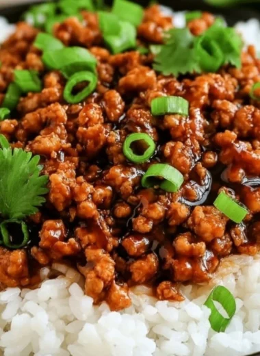 Honey garlic turkey dish garnished with green onions served on a plate