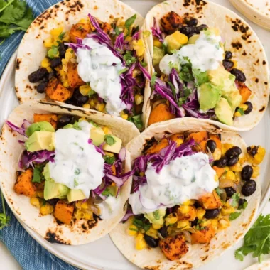 Delicious sweet potato and black bean tacos served with fresh toppings.