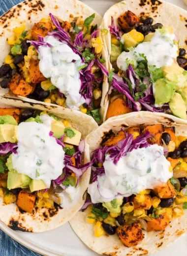 Delicious sweet potato and black bean tacos served with fresh toppings.
