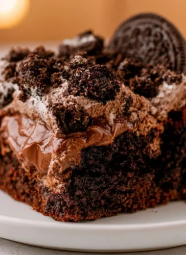 A delicious chocolate dirt cake decorated with gummy worms and crushed cookies.