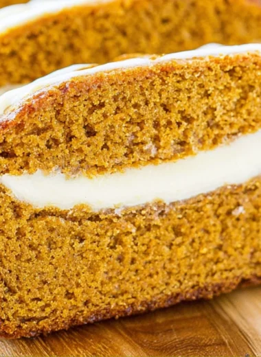 Cozy pumpkin bread with cream cheese drizzled on top