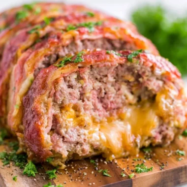 Deliciously smoked meatloaf served on a rustic wooden table