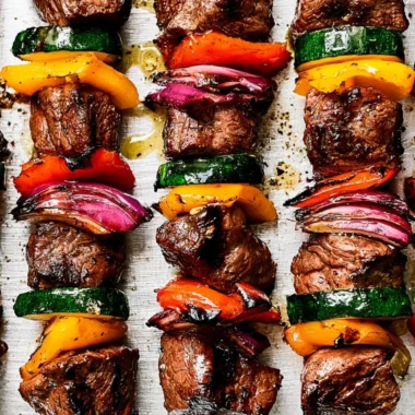 Delicious cozy steak kabobs with colorful vegetables on skewers