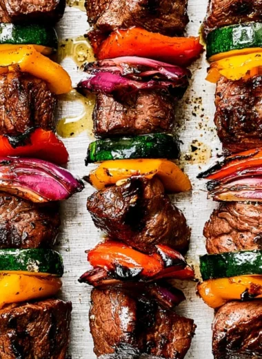 Delicious cozy steak kabobs with colorful vegetables on skewers