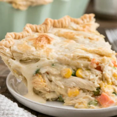 Delicious semi-homemade chicken pot pie served on a rustic wooden table.