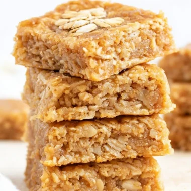 Delicious homemade soft and chewy apple oatmeal bars on a wooden table